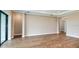 Open-concept living room features wood-look tile and neutral walls with ceiling trim detail at 4204 Barbuda Ln, Kissimmee, FL 34758
