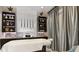 Indulge in a private spa with modern fixtures, cabinetry and counterspace with luxurious grey accent drapes at 4204 Barbuda Ln, Kissimmee, FL 34758