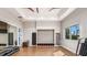 Inviting workout space with wood floor, large mirror, and natural light offering a serene exercise environment at 4204 Barbuda Ln, Kissimmee, FL 34758
