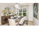 Dining room with modern decor and an elegant chandelier at 4210 Barbuda Ln, Kissimmee, FL 34758