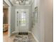 Inviting foyer featuring decorative tile flooring and a stylish front door at 4210 Barbuda Ln, Kissimmee, FL 34758