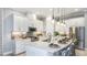Modern kitchen with white cabinets, stainless steel appliances, and a spacious center island at 4210 Barbuda Ln, Kissimmee, FL 34758