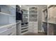 A spacious walk-in closet featuring custom shelving, ample storage, and efficient organization at 4210 Barbuda Ln, Kissimmee, FL 34758