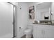 Bathroom features a glass shower, toilet, vanity, and neutral paint at 4375 Scene Ln, Kissimmee, FL 34746