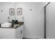 Modern bathroom with a walk-in shower, vanity and plants on the counter at 4375 Scene Ln, Kissimmee, FL 34746