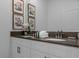 Bathroom featuring dual sinks, vanity, framed art, and floral decor at 4375 Scene Ln, Kissimmee, FL 34746