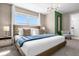 Sun-filled bedroom with large windows, contemporary lighting, and ensuite access at 4375 Scene Ln, Kissimmee, FL 34746