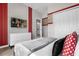 Fun bedroom featuring grid wallpaper, Mickey Mouse decor, and light colored carpet at 4375 Scene Ln, Kissimmee, FL 34746