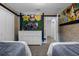 Bedroom with twin beds, playful décor, a TV and white double doors at 4375 Scene Ln, Kissimmee, FL 34746
