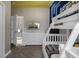 Comfortable bedroom with a bunk bed, TV and a six-drawer dresser at 4375 Scene Ln, Kissimmee, FL 34746