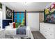 Comfortable bedroom with twin beds, white dresser, and playful décor at 4375 Scene Ln, Kissimmee, FL 34746