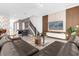 Open-concept area features a sectional sofa, pool table, and media wall for seamless entertainment at 4375 Scene Ln, Kissimmee, FL 34746