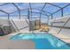 Inviting screened pool area with clear blue water and outdoor lounge seating at 4375 Scene Ln, Kissimmee, FL 34746