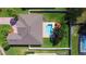 An aerial view highlights this home's roof, brick driveway, fenced yard, pool, and landscaping at 4412 Conroy Club Dr, Orlando, FL 32835