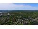 This aerial view shows the neighborhood, lake, and green spaces of the surrounding community at 4412 Conroy Club Dr, Orlando, FL 32835