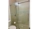 Modern bathroom featuring a glass-enclosed shower with decorative tiling and updated fixtures at 4412 Conroy Club Dr, Orlando, FL 32835
