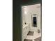 A modern bathroom with white cabinets, a marble countertop, and a framed mirror that reflects the adjacent room at 4412 Conroy Club Dr, Orlando, FL 32835