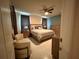 Spacious bedroom showcasing sitting area and ample dresser space at 4412 Conroy Club Dr, Orlando, FL 32835