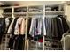 Well-organized walk-in closet with extensive shelving and hanging space for clothes, shoes, and accessories at 4412 Conroy Club Dr, Orlando, FL 32835