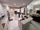 Contemporary kitchen featuring white cabinets, stainless steel appliances, and bar seating at 4412 Conroy Club Dr, Orlando, FL 32835