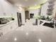 Bright kitchen with white cabinets, quartz countertop, and stainless steel appliances at 4412 Conroy Club Dr, Orlando, FL 32835