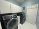 Bright laundry room with modern Samsung washer and dryer at 4412 Conroy Club Dr, Orlando, FL 32835