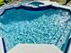 Inviting pool with spa featuring bright blue tile and sunlit water at 4412 Conroy Club Dr, Orlando, FL 32835