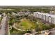 A picturesque view of the community park with trees and lush green spaces in a vibrant community at 4608 Atwood Dr, Orlando, FL 32828