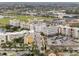 Aerial cityscape view featuring buildings, a lake and roadways in a bustling community at 4608 Atwood Dr, Orlando, FL 32828