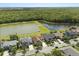 Aerial view of homes backing up to a body of water, surrounded by trees at 4608 Atwood Dr, Orlando, FL 32828