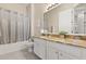 Bathroom with granite countertop and a tub with shower at 4608 Atwood Dr, Orlando, FL 32828