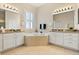 Luxurious bathroom with double vanity, soaking tub, and bright natural light at 4608 Atwood Dr, Orlando, FL 32828