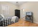 Bedroom featuring hardwood floors, television and an ensuite bathroom at 4608 Atwood Dr, Orlando, FL 32828