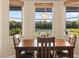 Cozy dining area with a table overlooking the lake at 4608 Atwood Dr, Orlando, FL 32828