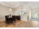 Dining room featuring hardwood floors, a chandelier, and views into other living areas at 4608 Atwood Dr, Orlando, FL 32828