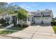 Charming two-story home featuring a three-car garage and inviting front porch at 4608 Atwood Dr, Orlando, FL 32828
