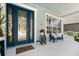 Inviting front porch with bench seating and decorative glass front door at 4608 Atwood Dr, Orlando, FL 32828