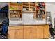 Organized garage with cabinets and countertop, providing ample storage and workspace for projects and household needs at 4608 Atwood Dr, Orlando, FL 32828