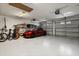 Well-organized garage with epoxy flooring, space for two cars, kayak storage, and bicycle racks at 4608 Atwood Dr, Orlando, FL 32828