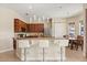 Kitchen featuring an island with seating, stainless steel appliances, and hardwood cabinets at 4608 Atwood Dr, Orlando, FL 32828