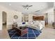 Bright open-concept living room featuring a stylish white sectional and a modern kitchen with stainless steel appliances at 4608 Atwood Dr, Orlando, FL 32828