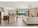 Open living space featuring tile flooring, a kitchen island, and sliding glass doors to the backyard at 4608 Atwood Dr, Orlando, FL 32828