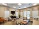 Relaxing lounge featuring comfortable seating, a TV, and natural light at 4608 Atwood Dr, Orlando, FL 32828