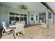 Charming covered patio with stylish furniture, creating a comfortable and inviting outdoor lounge area at 4608 Atwood Dr, Orlando, FL 32828