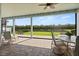 Enjoy the screened patio with outdoor seating and peaceful lake views in this backyard retreat at 4608 Atwood Dr, Orlando, FL 32828