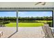 Bask in scenic tranquility from this screened patio overlooking a lush yard and serene lake at 4608 Atwood Dr, Orlando, FL 32828