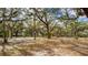 A shady playground with mature trees, swings, and picnic tables offers a fun outdoor recreational space at 4608 Atwood Dr, Orlando, FL 32828