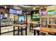 Restaurant interior featuring rustic tables, exposed brick, and vibrant 'Marketplace Avalon Park' sign at 4608 Atwood Dr, Orlando, FL 32828