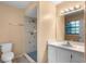 Bathroom featuring a walk-in shower with tile surround and vanity at 4772 Lake Ridge Rd # 66, Orlando, FL 32808