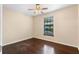 Bedroom featuring hard wood floors, a ceiling fan and a window at 4772 Lake Ridge Rd # 66, Orlando, FL 32808